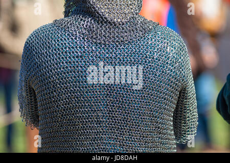 Rear view of a man in hauberk at the festival `Legends of the Norwegian Vikings` on City Day Stock Photo